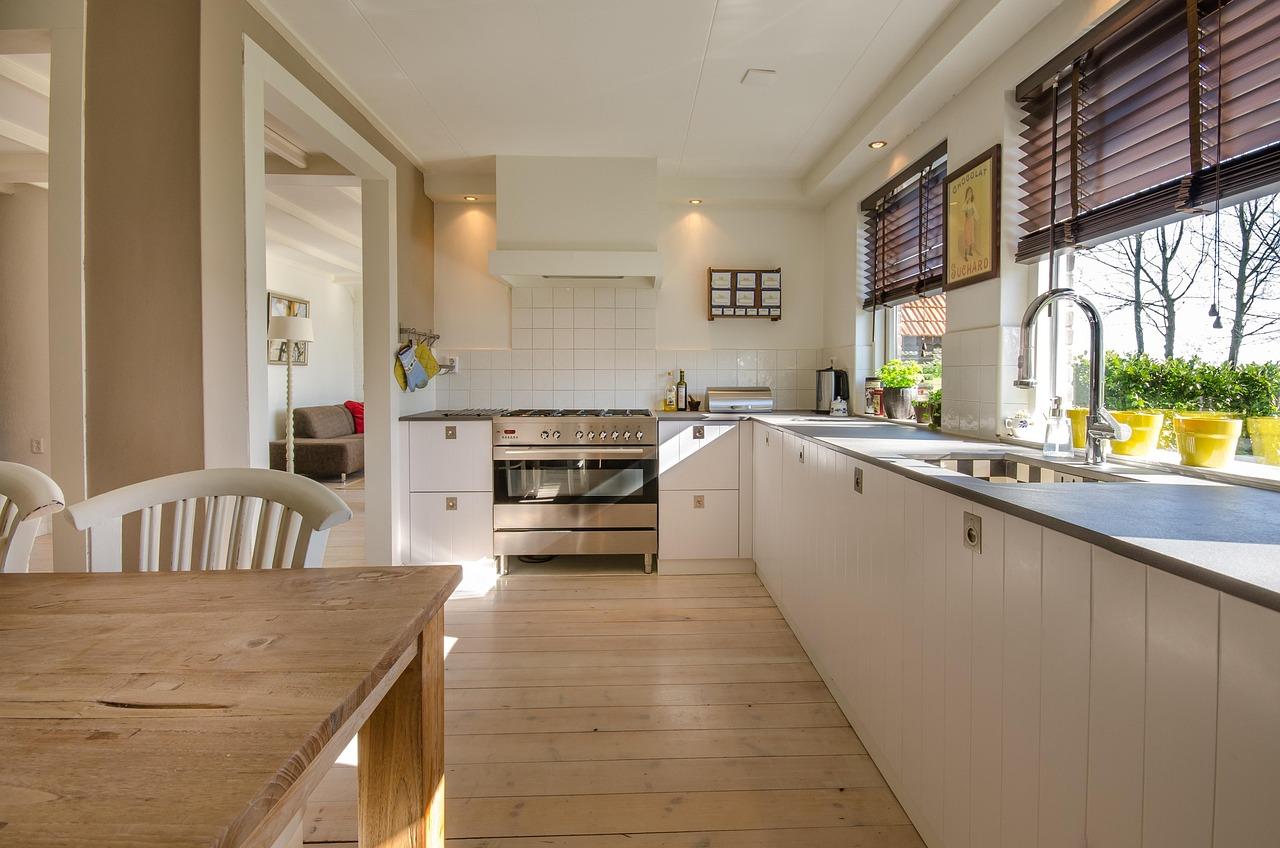 Modern kitchen with clean countertops and backsplash area showing light-filled interior